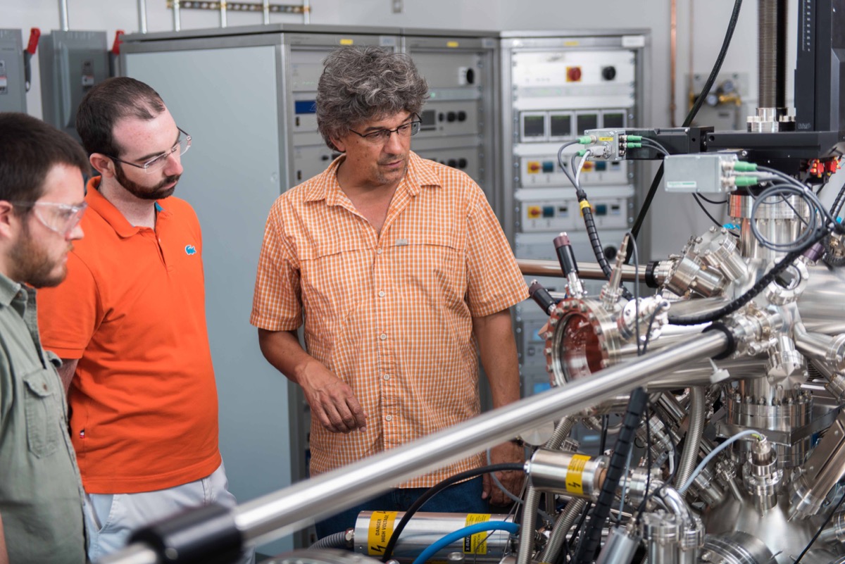 Students and a faculty member working in an engineering laboratory